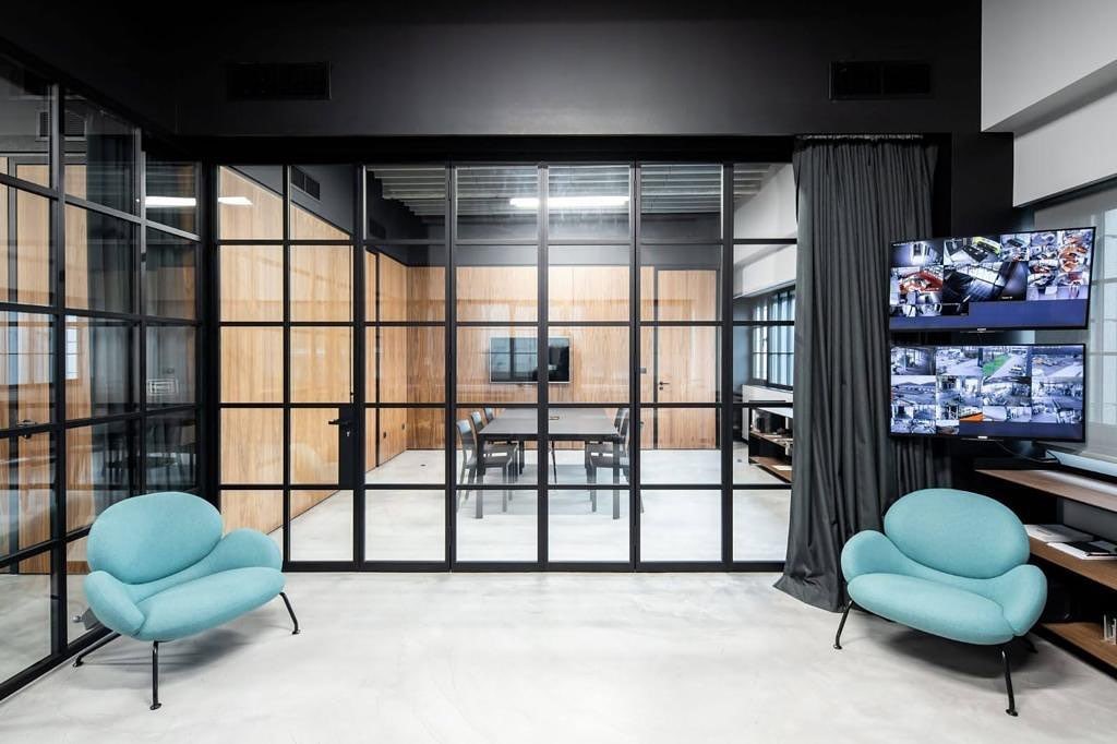 Meeting room and lounge area separated by glass doors